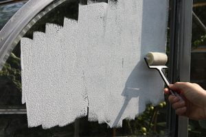 Using a small craft roller to apply Glass Paint