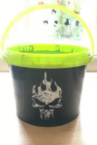 Halloween-trick-or-treat-plastic-bucket-painted-with-Thorndown-Bat-Black-Peelable-Glass-Paint-and-White-Witch-skull-stencil