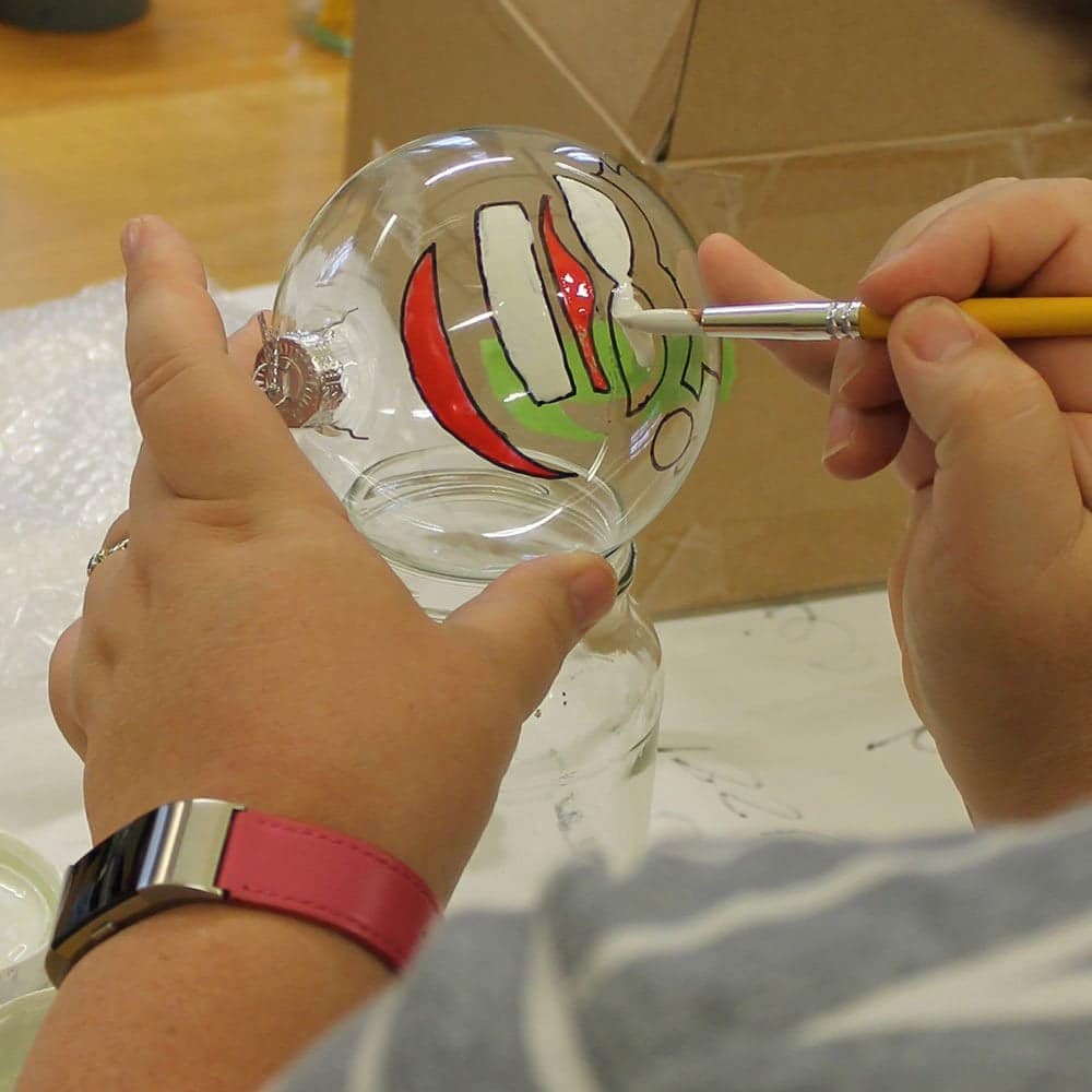 Painting-Santa-stencil-shape-on-plastic-bauble-decoration-with-Dragon-Red-and-Swan-White-Peelable-Glass-Paint
