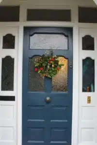 Thorndown-Bishop-Blue-Wood-Paint-front-door-with-Christmas-wreath