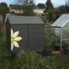 Sarah-Ireland-Shed-Bergamot-Grey-with-flower-in-Meadowsweet-Cream-and-Golden-Somer-Wood-Paint