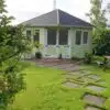 Thorndown-Rhyne-Green-and-Limestone-Wood-Paint-on-summerhouse