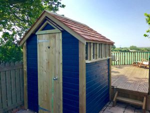 Thorndown-Bishop-Blue-Wood-Paint-on-Wood-and-Space-shed-in-garden