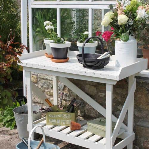 Thorndown-Whey-White-Wood-Paint-on-Forest-Potting-Bench-with-trugs-and-pots_sq