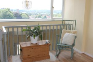 Thorndown-Bullrush-Green-Wood-Paint-on-Rocking-Chair-by-Spray-Box-and-Tree-Lichen-bannisters_3